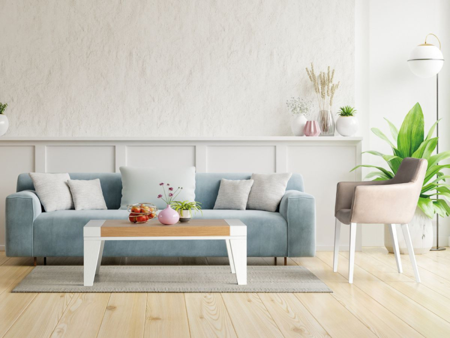 Ambiente de salón con sofá, mesa de centro y sillón Hugo co