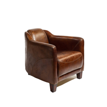 Sillón en piel de vaca envejecida color cigar, de Crisal Decoración