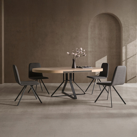 Mesa de comedor redonda Hiedra de la marca Pemi Mobiliario en vista de ambiente con extendible sacado.
