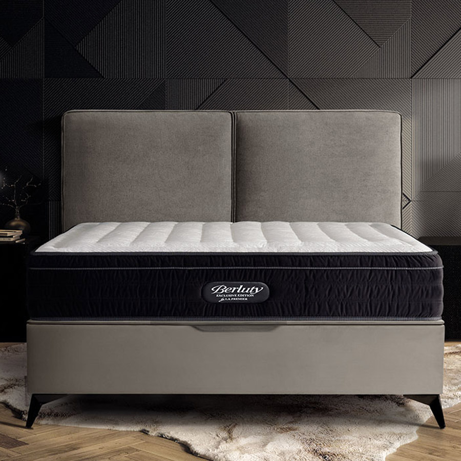 Cama tapizada en color gris con colchón Berluty de La Premier