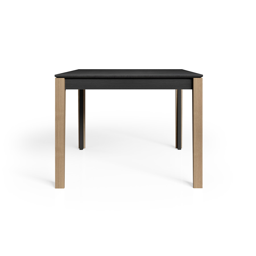 Mesa de comedor Eden deTabula en acabado Vulcan con detalles de pata en roble.