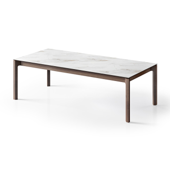 Mesa extensible Mercury de la firma portuguesa Tabula con tapa cerámica y patas en nogal