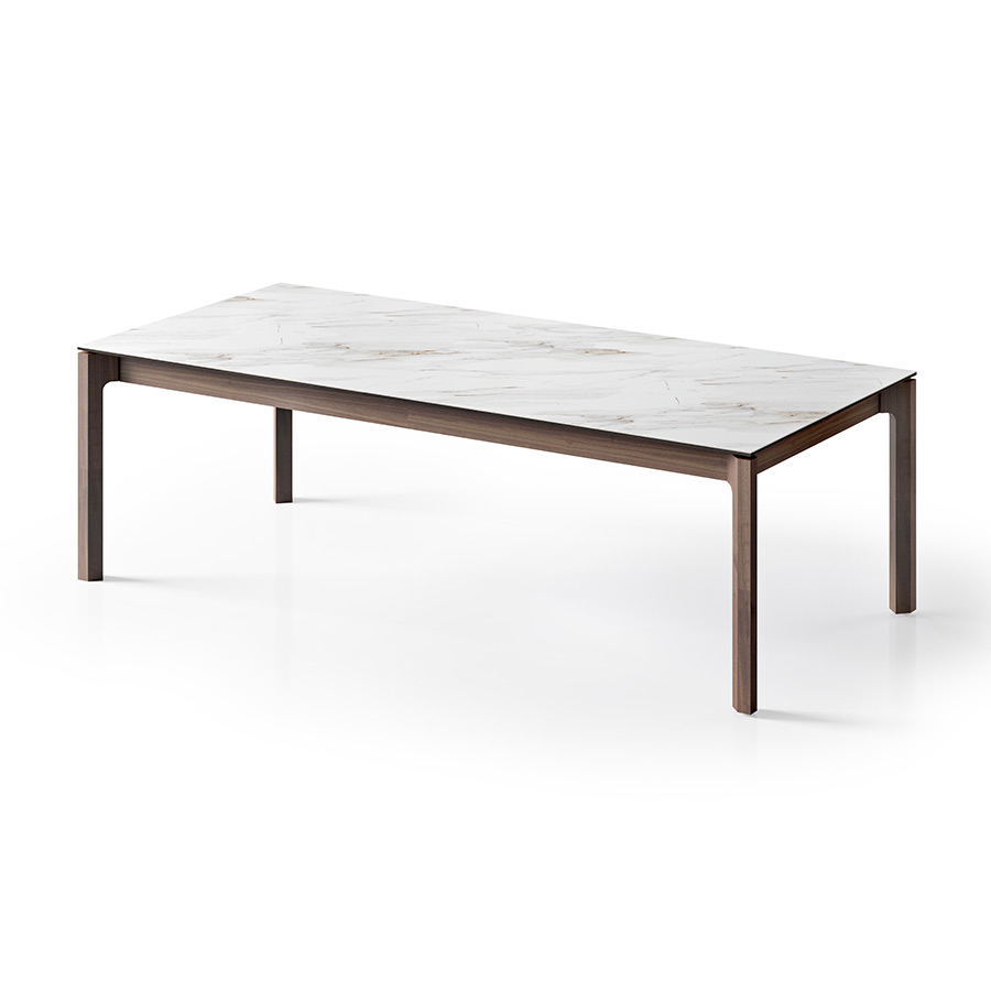 Mesa extensible Mercury de la firma portuguesa Tabula con tapa cerámica y patas en nogal