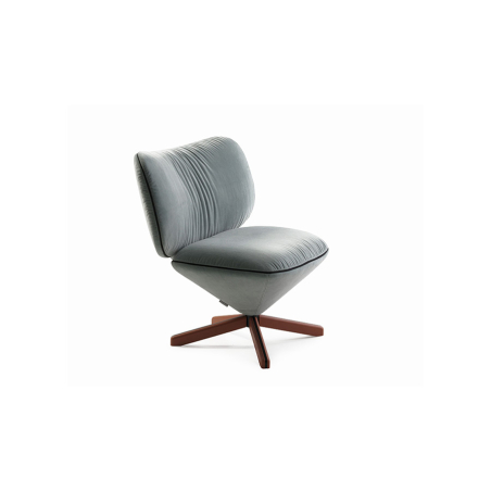 Butaca Tortuga Mini de la firma Sancal, con pie central de 4 aspas y tapizado en gris.