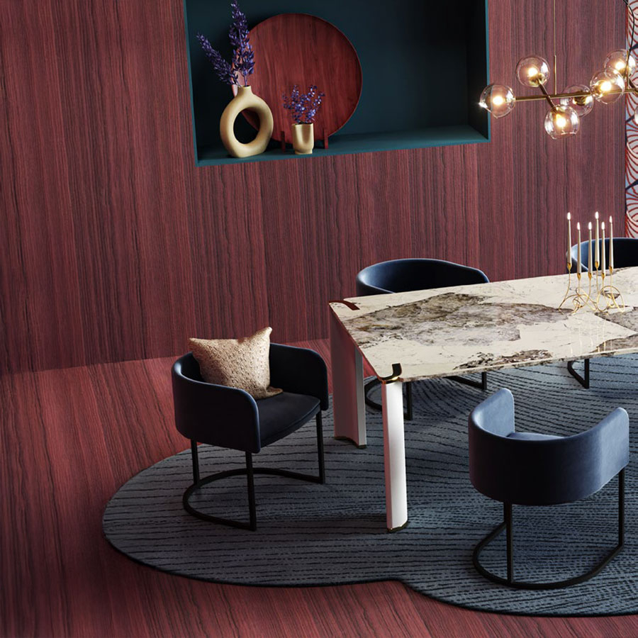 Detalle de la mesa de comedor Horus con silla c-chair em tapizado azul oscuro.